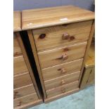 A modern pine chest of five drawers
