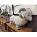 A large fluffy footstool in the form of ram