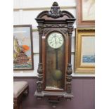 A Victorian walnut veneered Vienna wall clock