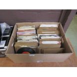 A box containing a quantity of 45RPM records to include Gary Puckett and The Union Gap, Dolly