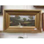 A gilt framed oil on board of bridge over river scene signed Dalton