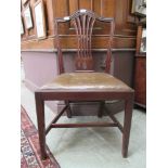 A Georgian mahogany dining chair with olive green leatherette pad seat