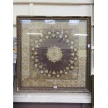 A framed and glazed Indian needlework incorporating golden threads