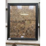 A framed and glazed multimedia artwork incorporating seaweed and mussel shells depicting the beach