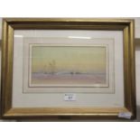 A gilt framed and glazed watercolour of desert camel scene, signed bottom right