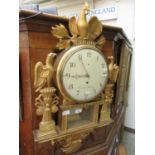 A gilt drop dial wall clock by Beurling Stockholm with griffin and cockerel design