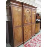 A 19th century walnut compactum having centre section with door above four drawers being flanked