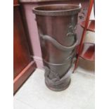 A Japanese bronze finish stick stand with dragon designBottom coming away from side, photo for