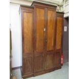 A Georgian style mahogany two door breakfront wardrobe