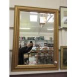 A rectangular gilt framed bevel glass mirror