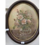 An oval framed oil of still life signed Dorothy Wallace