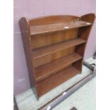 An early 20th century mahogany open bookcase