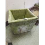 A weathered stoneware planter