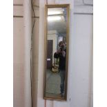 A gilt framed rectangular mirror