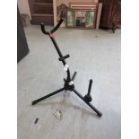 A tubular metal saxophone stand