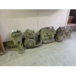 A selection of composite stone garden ornaments in the form of water mill, cottages, tower, etc