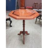 An early 20th century parquetry octagonal topped occasional table