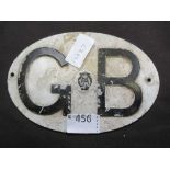 A painted GB AA car badge