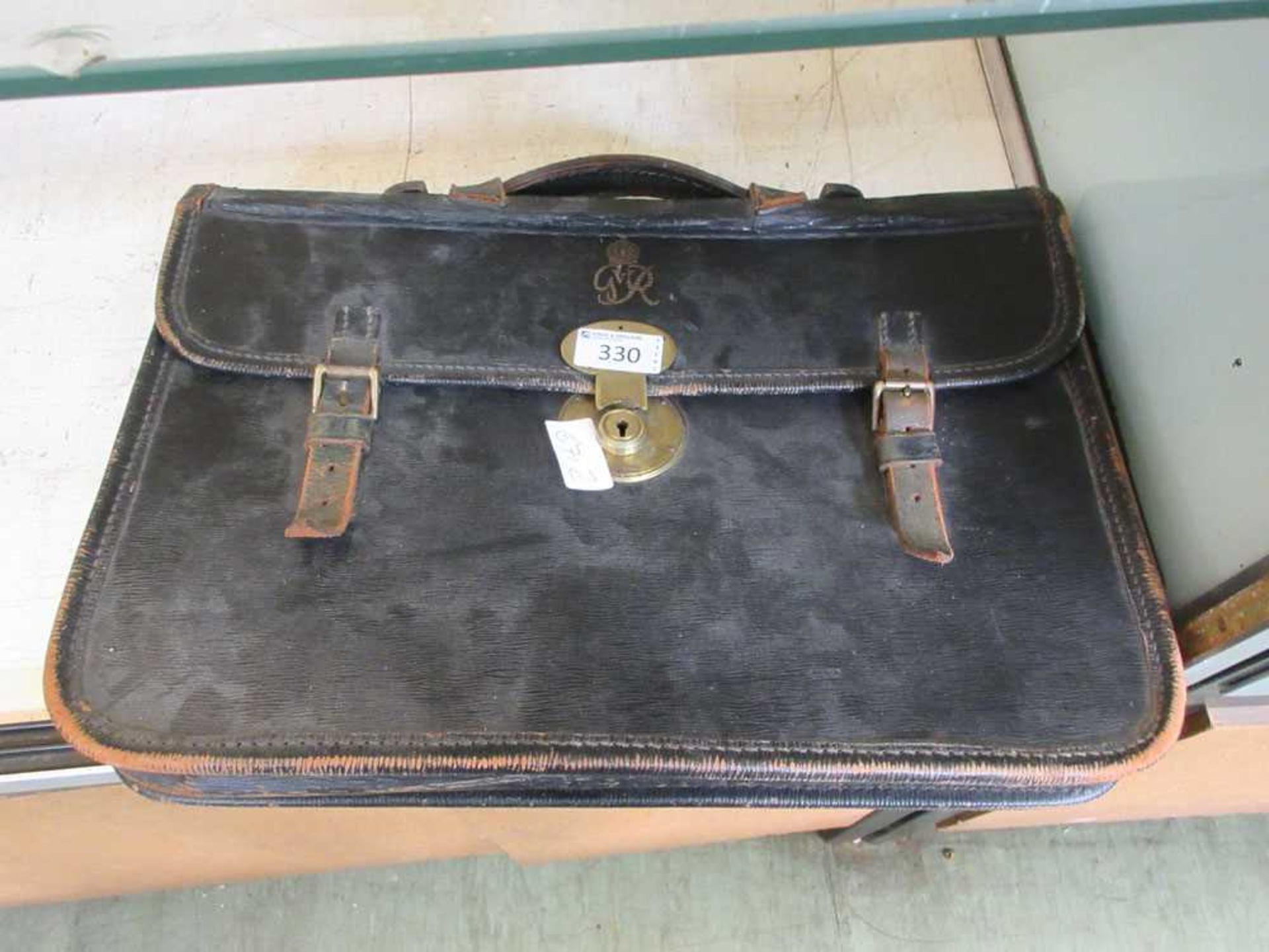 An early 20th century leather satchel having monogram GR with crown