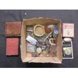 A box containing chains, perfume bottles, etc