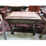 An early 20th century oak music stool with lift-up seat on barley twist legs and stretchers