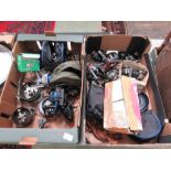 Two trays of fishing reels