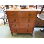 An early 20th century walnut four drawer chest