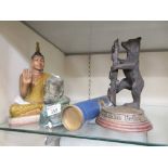 A carved wooden Buddha together with a plaster moulded eastern figure (A/F) together with a