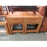 A pair of modern oak lamp tables with single drawer and glazed under tier