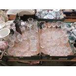Two trays of glassware to include drinking vessels, decanters, pouring jugs, etc