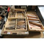 A selection of wood carving tools including chisels