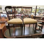 A pair of Edwardian mahogany satinwood banded and boxwood strung bedroom chairs