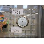 A modern glass mantle clock