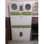 An early 20th century cream and green painted kitchen maid