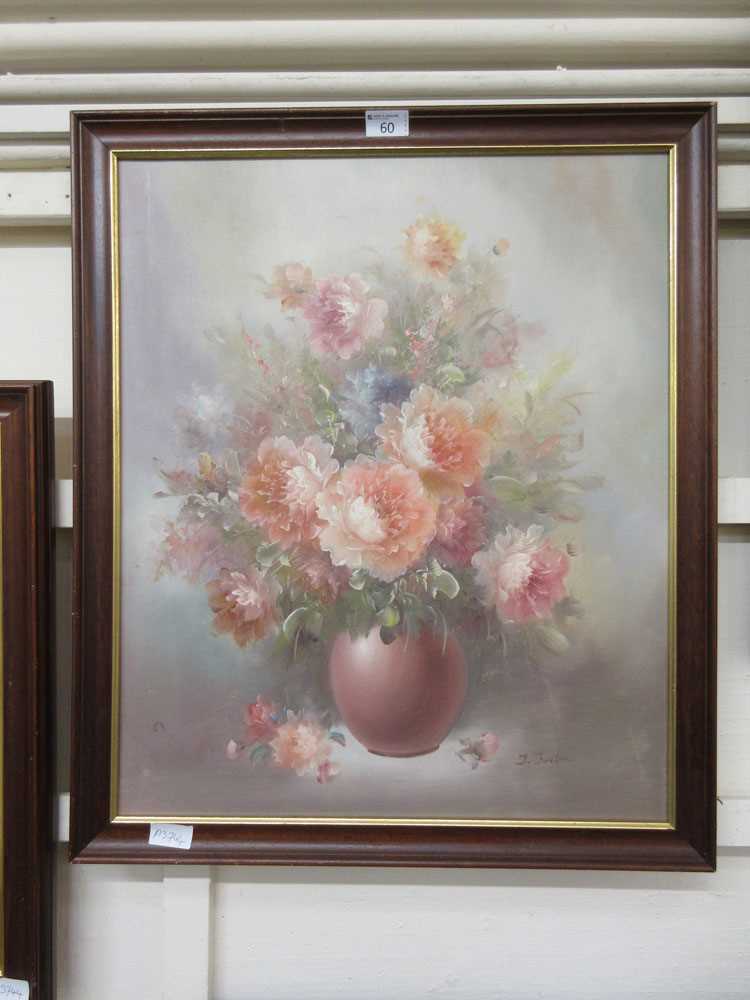 A framed oil on canvas of still life signed bottom right