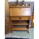 An early 20th century oak student's bureau, the galleried top with fall front over single drawer and