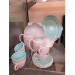 A selection of lilac and teal Poole Pottery teaware to include six cups and saucers, teapot, shell