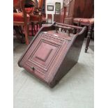 A late 19th century mahogany coal scuttle with brass carry handle