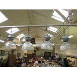 A set of four industrial style ceiling hanging lights