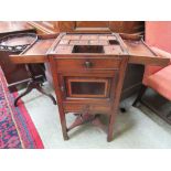 An 18th century mahogany dressing cabinet, the fold out top enclosing a fitted interior over pot