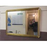 A gilt framed bevel glass mirror