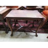 An early 20th century and later mahogany occasional table on carved cabriole legs