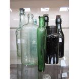 A selection of old coloured glass bottles