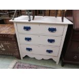 A white painted chest of three drawers