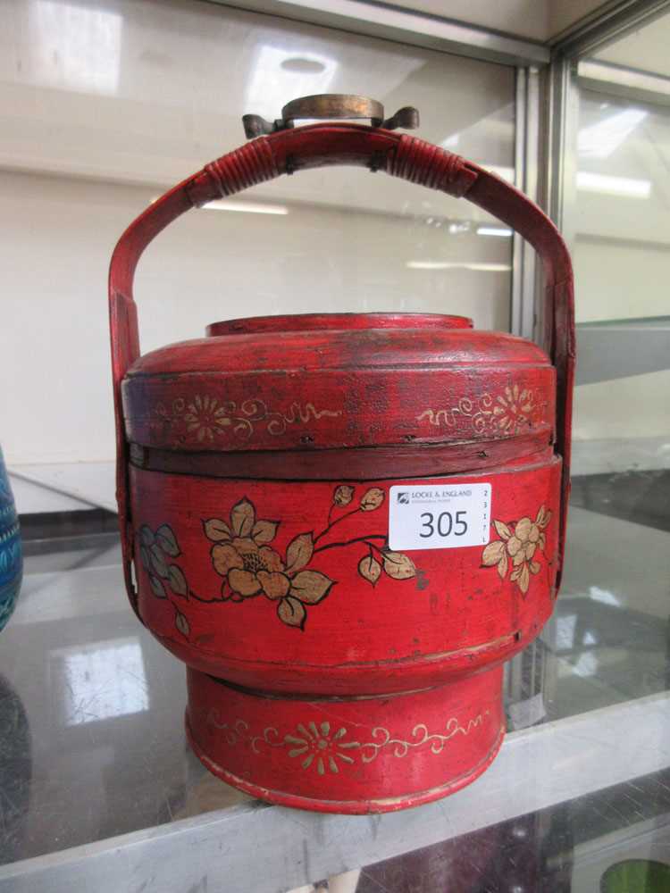 A red and gilt decorated oriental handled pot