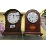 An oak cased mantle clock along with a walnut cased mantle clock