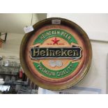 A moulded Heineken advertising plaque