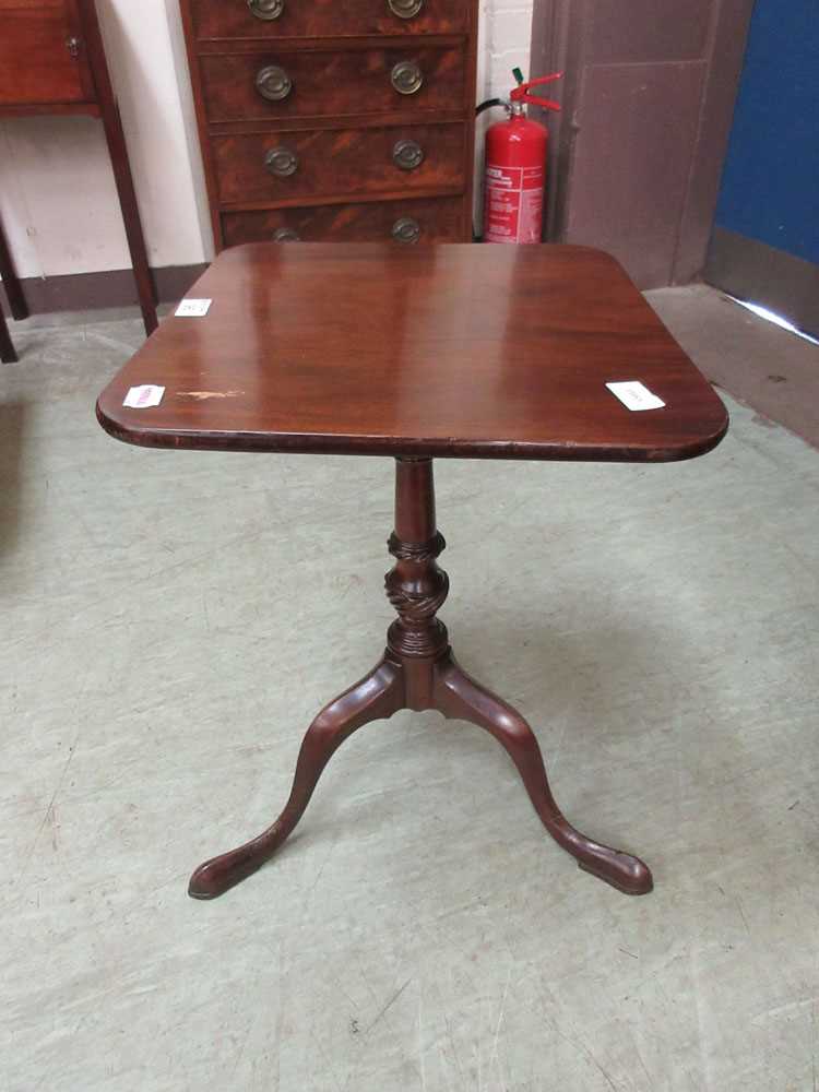 An early 20th century mahogany tilt-top tripod table