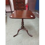 An early 20th century mahogany tilt-top tripod table