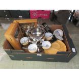 A tray containing a fondue set, storage boxes, oriental style bowls, etc